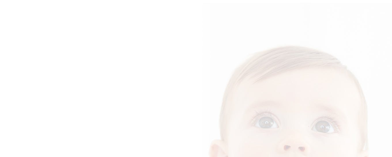 header - close up of babies head with eyes looking up